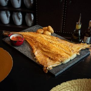 Roasted Whole Salty Cod Fish with Crunched New Potatoes and Garlic - Whole